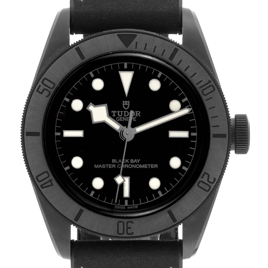 The Tudor Heritage Black Bay watch is shown from the front, highlighting the bezel, dial, hands, and strap.